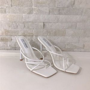 White, scrappy mules with clear strap